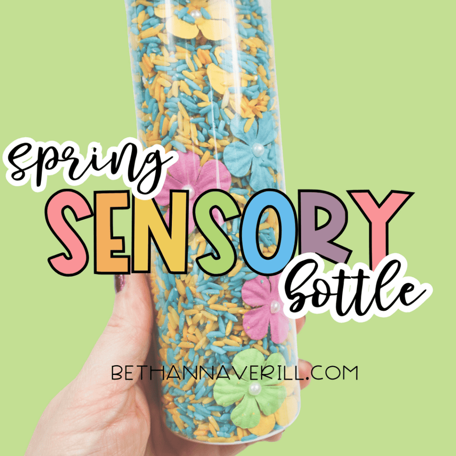Hand holding a spring sensory bottle filled with dyed rice and flowers with text overlay reading “Spring Sensory Bottle.”