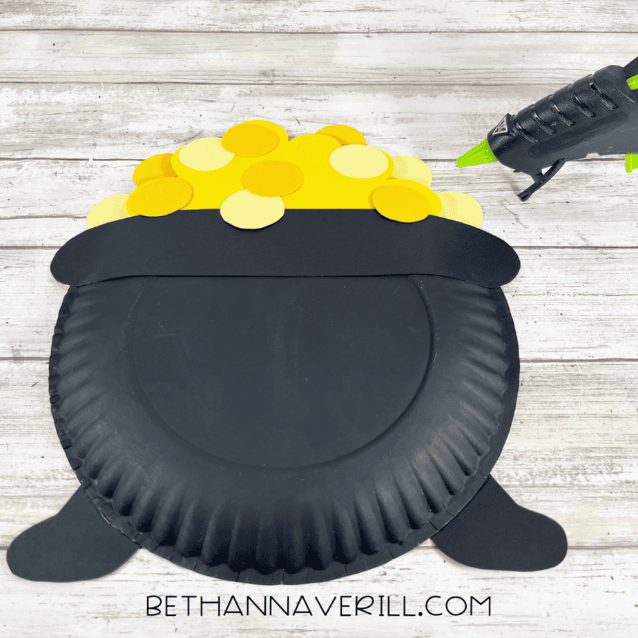 Image of yellow paper circles layered on top of the pot to create gold coins.