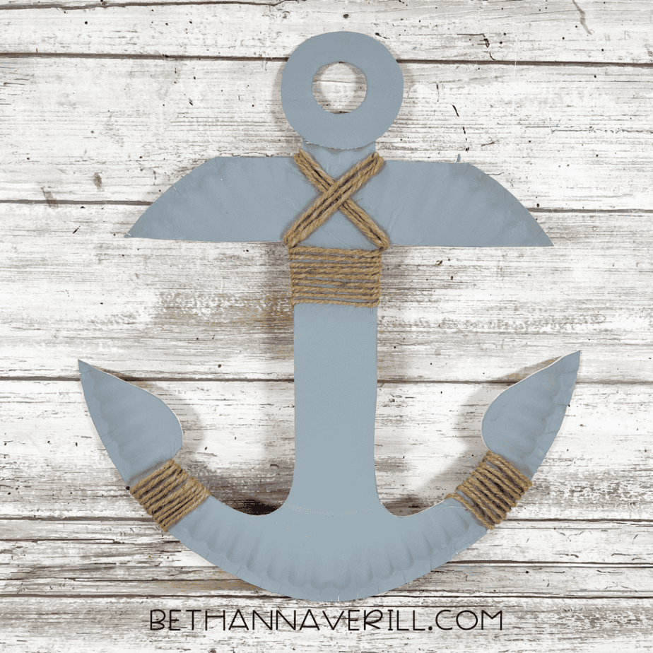Finished gray anchor craft made from a paper plate with twine wrapped around the center and sides.