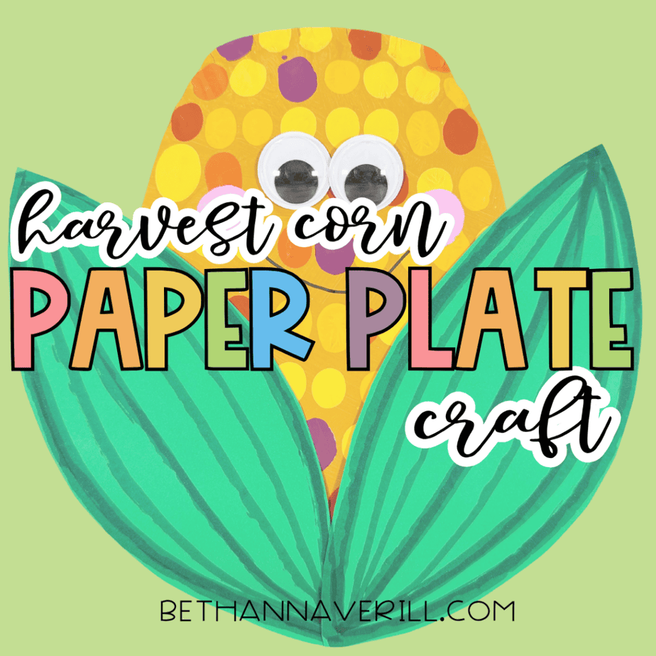 Harvest corn paper plate craft with colorful painted dots, googly eyes, pink cheeks, smiling face, and large green leaves on a light green background with text reading “harvest corn paper plate craft.”