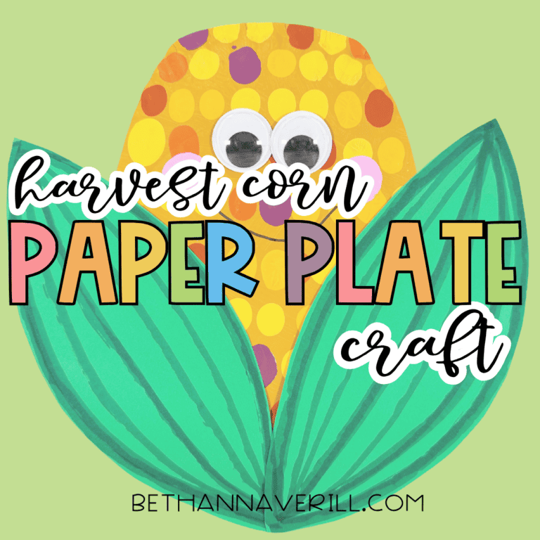 Harvest corn paper plate craft with colorful painted dots, googly eyes, pink cheeks, smiling face, and large green leaves on a light green background with text reading “harvest corn paper plate craft.”